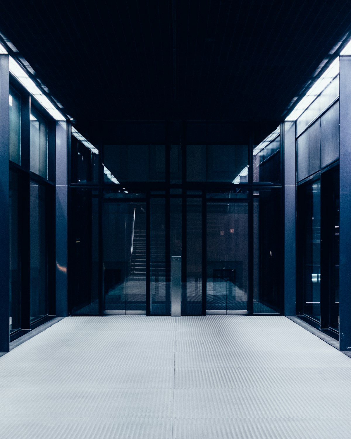 Modern data-center corridor with glass aisle containment and high-density racks